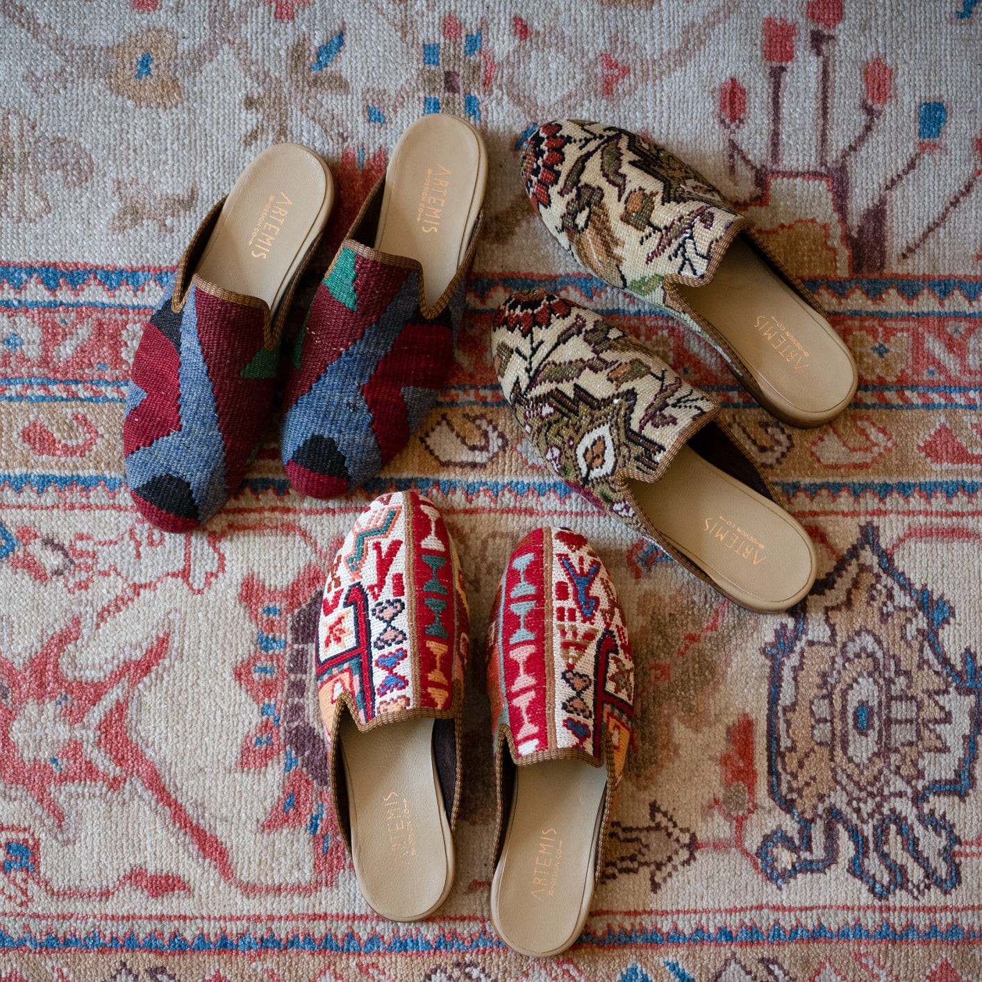3 pairs of men's kilim slippers on oriental carpet