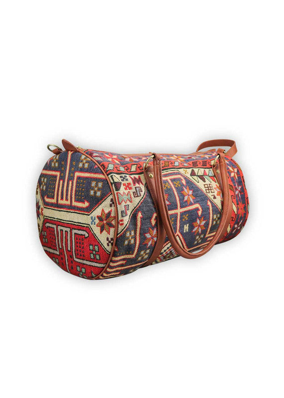 The Artemis Design & Co Travel Duffle Bag is a vibrant travel essential, boasting a lively color combination of red, white, blue, cream, orange, green, and maroon. Meticulously crafted, this duffle bag seamlessly blends patriotic and earthy tones, creating a dynamic and stylish companion for your journeys. The interplay of colors, from the patriotic red, white, and blue to the warm cream, energetic orange, lush green, and rich maroon, adds a playful and modern flair. (Side View)