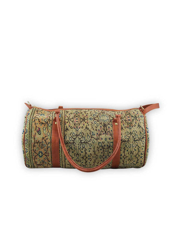 The Artemis Design & Co Travel Duffle Bag exudes timeless elegance with a sophisticated color palette of peach, brown, khaki, cream, and grey. Meticulously crafted, this duffle bag seamlessly blends warm and neutral tones, offering a chic and versatile travel companion. The interplay of colors, from the soft peach and khaki to the rich browns and creams, harmonized by the subtle greys, adds a touch of modern flair. (Front View)