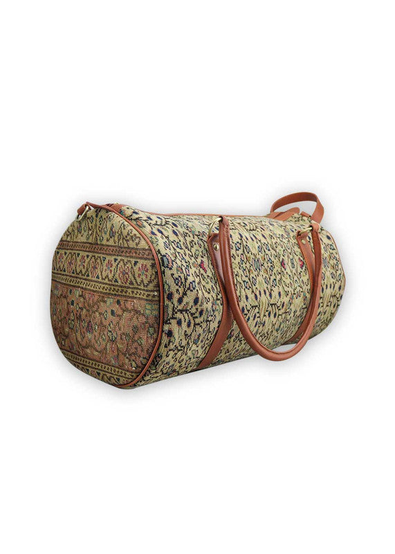 The Artemis Design & Co Travel Duffle Bag exudes timeless elegance with a sophisticated color palette of peach, brown, khaki, cream, and grey. Meticulously crafted, this duffle bag seamlessly blends warm and neutral tones, offering a chic and versatile travel companion. The interplay of colors, from the soft peach and khaki to the rich browns and creams, harmonized by the subtle greys, adds a touch of modern flair. (Side View)