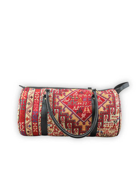 The Artemis Design & Co Travel Duffle Bag is a vibrant travel essential, boasting a lively color combination of red, white, blue, cream, orange, green, and maroon. Meticulously crafted, this duffle bag seamlessly blends patriotic and earthy tones, creating a dynamic and stylish companion for your journeys. The interplay of colors, from the patriotic red, white, and blue to the warm cream, energetic orange, lush green, and rich maroon, adds a playful and modern flair. (Side View)