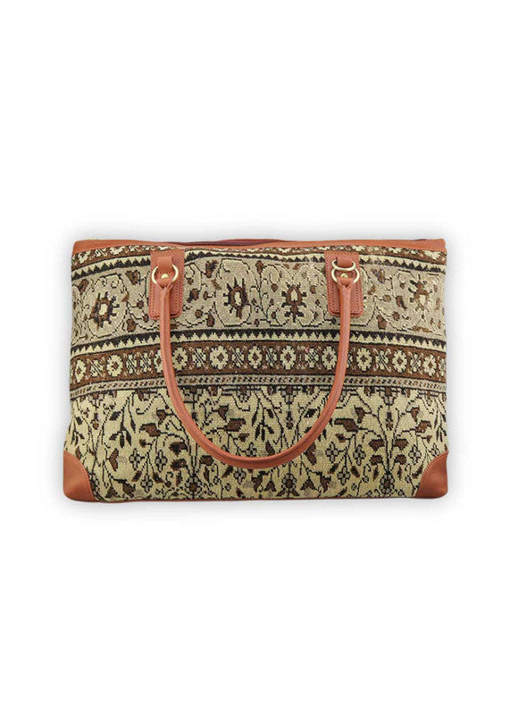 Artemis Design & Co Weekender Bag is an epitome of refined travel sophistication, boasting a harmonious color palette of brown, khaki, cream, green, blue, maroon, and black. Meticulously crafted, this spacious bag seamlessly blends earthy and neutral tones, creating a versatile and stylish accessory for your journeys. The dynamic interplay of colors, from the rich browns and khakis to the clean cream, subtle greens, calming blues, deep maroons, and classic black, adds a touch of modern flair. (Front View)