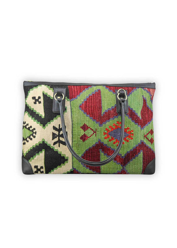 Artemis Design & Co Weekender Bag is a chic travel companion with a bold color combination of red, green, black, white, and red-orange. Meticulously crafted, this stylish bag effortlessly blends vibrant and neutral tones, creating a versatile accessory for your travels. The dynamic interplay of colors, from the lively red and green to the classic black and white, accentuated by the warm red-orange, adds a touch of modern flair. (Front View)