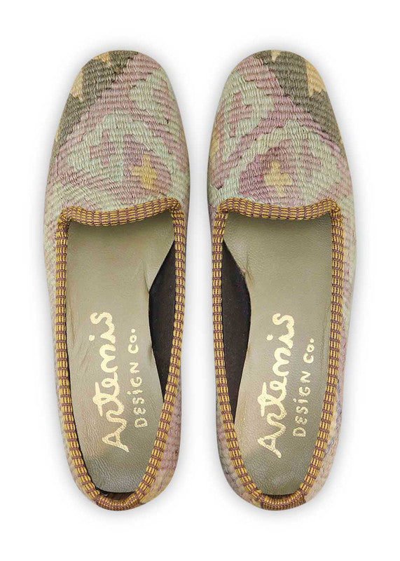 Artemis Design & Co Women's Loafers redefine classic elegance with a versatile color palette of brown, khaki, grey, yellow-orange, and light red. Meticulously crafted, these loafers seamlessly blend warm and neutral tones, creating a stylish and sophisticated footwear option. (Front View)