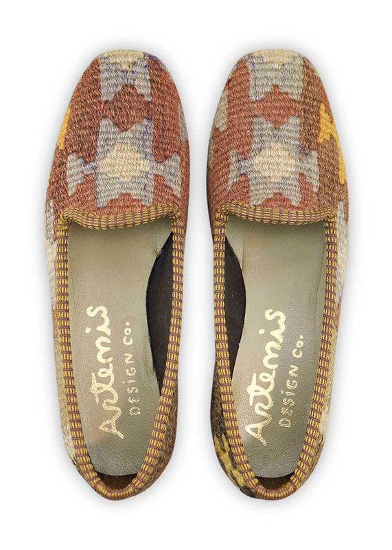 Artemis Design & Co Women's Loafers exude a sophisticated and earthy charm with a color palette of khaki, brown, grey, mustard, and rust. Meticulously crafted, these loafers seamlessly blend warm and neutral tones, creating a versatile and stylish footwear option. (Front View)