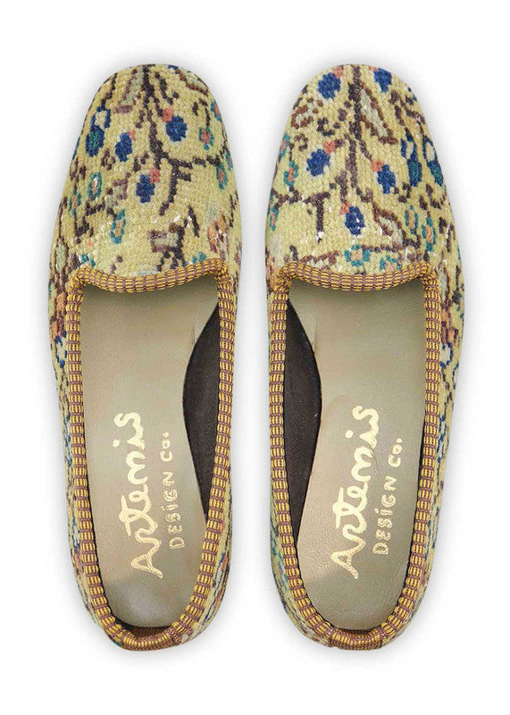 Artemis Design & Co Women's Loafers elevate your style with a tasteful color palette of khaki, peach, blue, white, brown, green, and grey. Meticulously crafted, these loafers seamlessly blend earthy and cool tones, creating a versatile and sophisticated footwear option. (Front View)