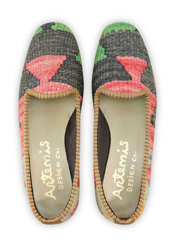 Artemis Design & Co Women's Loafers redefine style with a bold color palette of green, black, red, grey, orange, and blue. Meticulously crafted, these loafers seamlessly blend vibrant and neutral tones, creating a versatile and fashionable footwear option. (Front View)