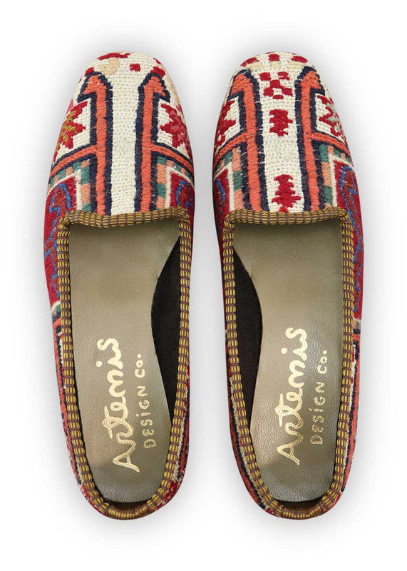 Artemis Design Co. Women's Loafers radiate modern charm with a lively color palette of red, white, black, sky blue, peach, and blue. Meticulously crafted, these loafers seamlessly blend classic and vibrant tones, creating a versatile and stylish footwear option. The dynamic interplay of colors, from the bold reds and blues to the crisp white, classic black, and soft peach, adds a touch of contemporary flair. (Front View)