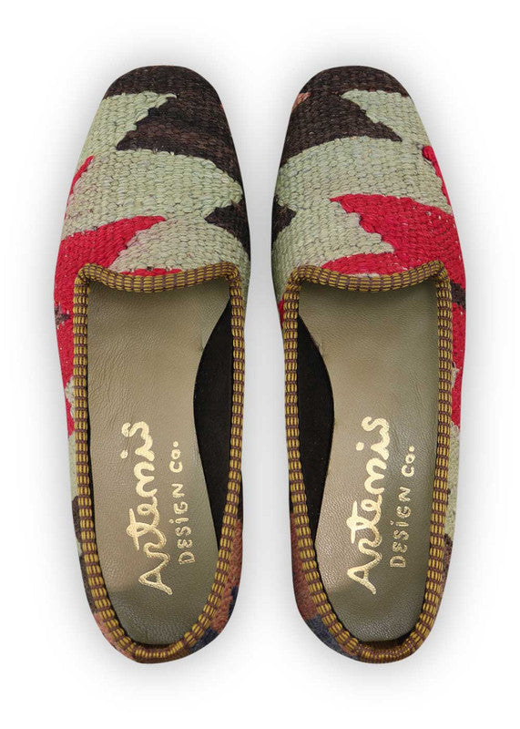 Artemis Design Co. Women's Loafers embody versatile sophistication with a dynamic color palette of peach, black, grey, brown, blue, and red. Meticulously crafted, these loafers seamlessly blend warm and cool tones, creating a stylish and adaptable footwear option. The dynamic interplay of colors, from the soft peach and browns to the classic black and greys, complemented by the vibrant blue and red, adds a touch of modern flair. (Front View)