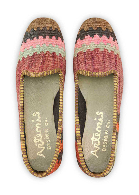 Artemis Design & Co Women's Loafers embody modern flair with a captivating color palette of brown, black, pink, mint green, red, and orange. Meticulously crafted, these loafers seamlessly blend earthy tones with vibrant hues, creating a versatile and stylish footwear option. (Front View)
