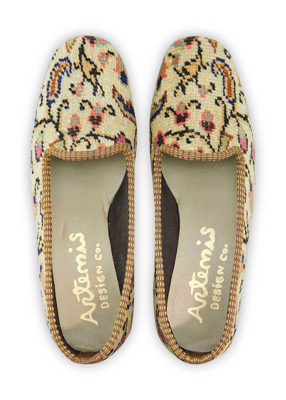 Artemis Design & Co Women's Loafers showcase a delightful color palette of khaki, blue, green, peach, red, white, and brown. Meticulously crafted, these loafers seamlessly blend earthy tones with vibrant hues, creating a versatile and stylish footwear option. (Front View)