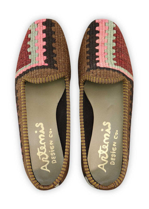 Artemis Design Co. Women's Loafers exude sophistication with a refined color palette of brown, pink, black, maroon, and white. Meticulously crafted, these loafers seamlessly blend warm and muted tones, creating a versatile and stylish footwear option. The dynamic interplay of colors, from the rich browns and maroons to the soft pinks and classic black, complemented by the crisp white, adds a touch of modern flair. (Front View)