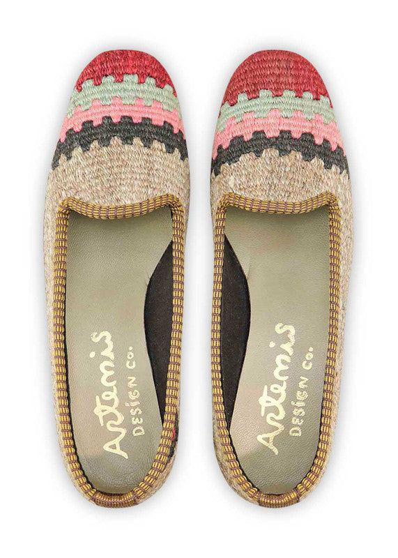 Artemis Design & Co Women's Loafers redefine elegance with a chic color palette of red, black, pink, grey, and khaki. These meticulously crafted loafers effortlessly blend classic sophistication with contemporary style. (Front View)