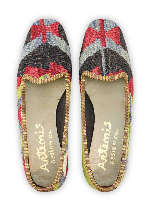 Artemis Design & Co Women's Loafers showcase a bold and dynamic color combination of blue, black, red, green, and white. These stylish loafers are a vibrant expression of contemporary fashion, seamlessly blending rich and contrasting hues. (Front View)