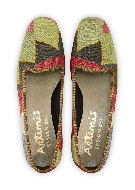 Artemis Design Co. Women's Loafers make a bold statement with a vibrant color palette of red, green, black, white, blue, and yellow. Meticulously crafted, these loafers seamlessly blend energetic and classic tones, creating a versatile and eye-catching footwear option. (Front View)