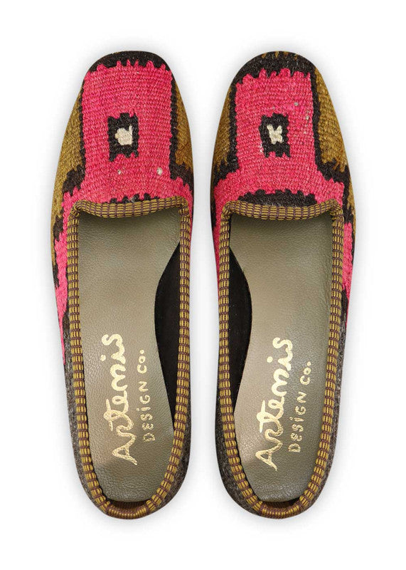 Artemis Design Co. Women's Loafers radiate sophistication with a refined color palette of dark grey, brown, black, and fuchsia. Meticulously crafted, these loafers seamlessly blend neutral and bold tones, creating a versatile and stylish footwear option. The dynamic interplay of colors, from the deep dark grey and brown to the classic black and vibrant fuchsia, adds a touch of modern flair.  (Front View)