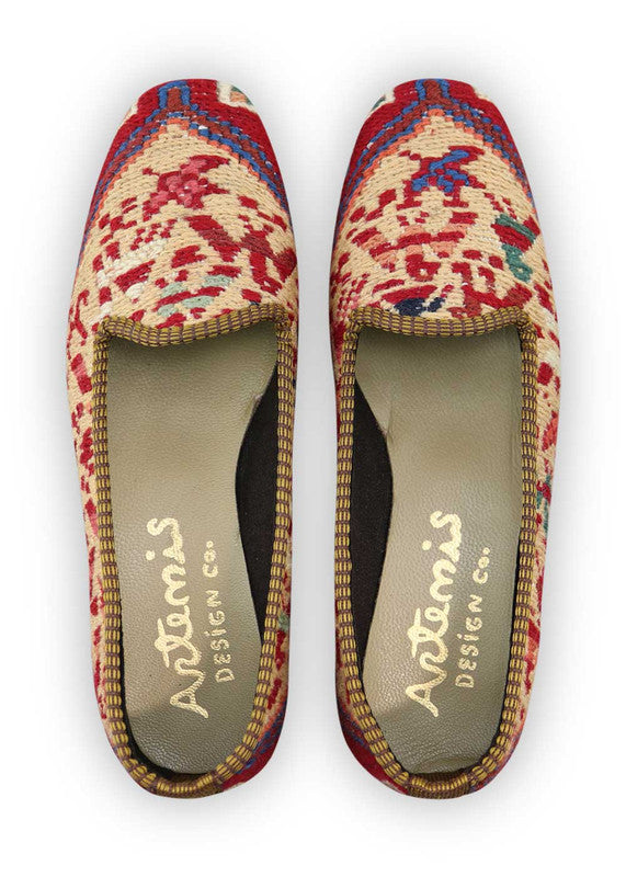 Artemis Design Co. Women's Loafers captivate with a stylish and versatile color palette, featuring peach, maroon, blue, grey, teal, brown, khaki, and sky blue. Meticulously crafted, these loafers seamlessly blend warm and cool tones, creating a chic and fashionable footwear option. The dynamic interplay of colors, from the soft peach and maroon to the calming blues and greys, accented by the rich browns, khakis, and vibrant teal, adds a touch of modern flair.  (Front View)