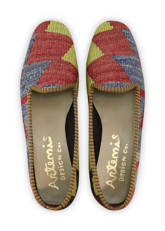 Artemis Design Co. Women's Loafers exude a vibrant and stylish charm with a dynamic color palette of red, green, white, black, and blue. Meticulously crafted, these loafers seamlessly blend bold and classic tones, creating a versatile and eye-catching footwear option. The dynamic interplay of colors, from the energetic red and green to the crisp white, classic black, and serene blue, adds a touch of modern flair. (Front View)