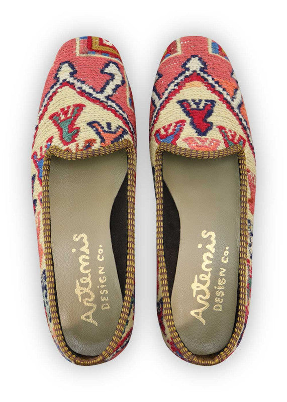 Artemis Design Co. Women's Loafers captivate with a stylish and versatile color palette, featuring peach, maroon, blue, grey, teal, brown, khaki, and sky blue. Meticulously crafted, these loafers seamlessly blend warm and cool tones, creating a chic and fashionable footwear option. The dynamic interplay of colors, from the soft peach and maroon to the calming blues and greys, accented by the rich browns, khakis, and vibrant teal, adds a touch of modern flair.  (Front View)