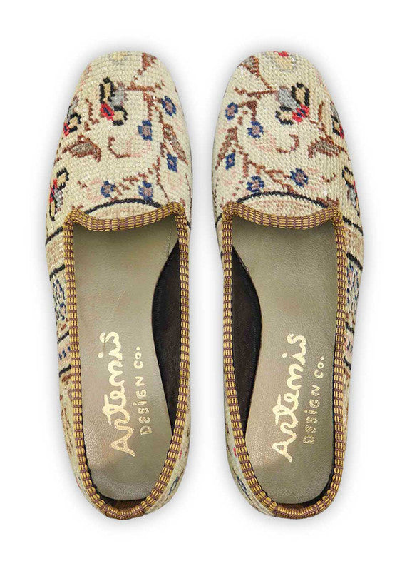 Artemis Design & Co Women's Loafers showcase a harmonious blend of earthy sophistication with a touch of cool hues. The color palette features rich tones of brown and khaki, complemented by crisp white, serene blue, and refreshing green. (Front View)