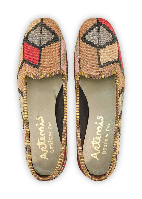 Artemis Design & Co Women's Loafers boast a captivating blend of warm and sophisticated tones, featuring a delightful color combination of peach, maroon, black, khaki, red, grey, and pink. These stylish loafers seamlessly merge elegance with a touch of playful charm, offering a versatile footwear option for any occasion. (Front View)