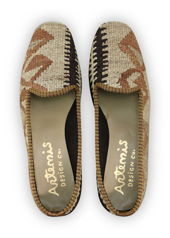 Artemis Design Co. Women's Loafers exude a sleek and sophisticated charm with a color palette of brown, black, and purple. Meticulously crafted, these loafers seamlessly blend neutral and bold tones, creating a versatile and stylish footwear option. The dynamic interplay of colors, from the classic brown and black to the rich purple, adds a touch of modern flair. (Front View)