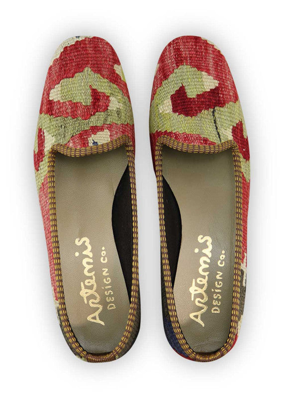 Artemis Design Co. Women's Loafers showcase a vibrant and timeless color combination of red, green, white, and black. Meticulously crafted, these loafers seamlessly blend bold and classic tones, creating a versatile and stylish footwear option. The dynamic interplay of colors, from the energetic red and green to the crisp white and classic black, adds a touch of modern flair. (Front View)