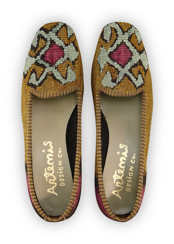 Artemis Design Co. Women's Loafers exude a sleek and sophisticated charm with a color palette of brown, black, and purple. Meticulously crafted, these loafers seamlessly blend neutral and bold tones, creating a versatile and stylish footwear option. The dynamic interplay of colors, from the classic brown and black to the rich purple, adds a touch of modern flair. (Front View)