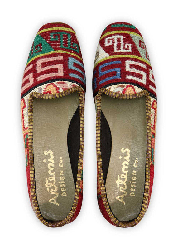 Artemis Design Co. Women's Loafers are a celebration of style with a patriotic color palette of red, white, and blue, complemented by the soft hues of peach, teal, khaki, and sky blue. Meticulously crafted, these loafers seamlessly blend bold and serene tones, creating a versatile and eye-catching footwear option. (Front View)