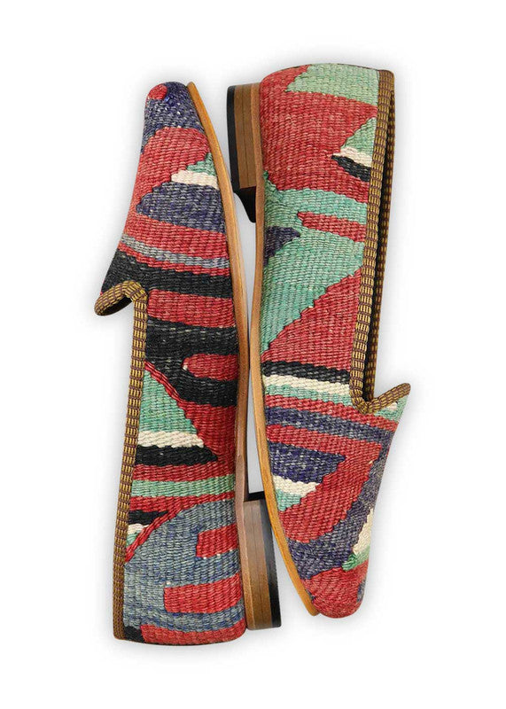 The Artemis Design & Co Women's Loafer is a stylish and versatile footwear choice with a classic yet vibrant color combination. Featuring shades of blue, red, green, white, and black, these loafers offer a timeless and sophisticated look.(Side View)