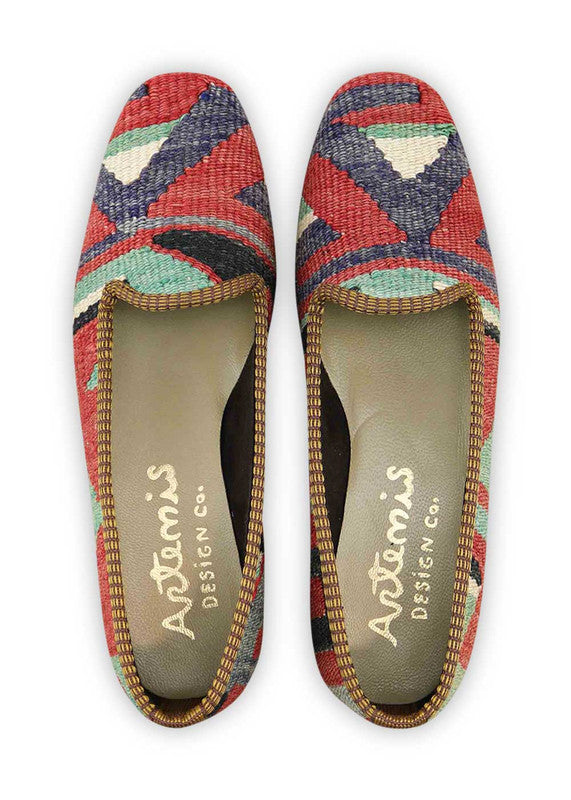 The Artemis Design & Co Women's Loafer is a stylish and versatile footwear choice with a classic yet vibrant color combination. Featuring shades of blue, red, green, white, and black, these loafers offer a timeless and sophisticated look.(Front View)