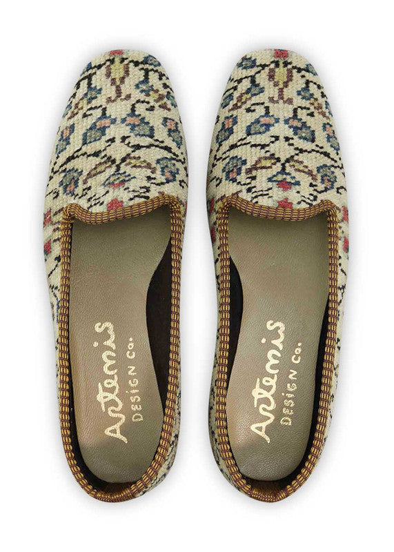 The Artemis Design & Co Women's Loafer is a fashionable and versatile footwear choice featuring a sophisticated color palette. With a combination of khaki, black, blue, peach, red, and brown, these loafers offer a harmonious and trendy look. Crafted with a keen eye for both style and comfort, they seamlessly complement a variety of outfits. (Front View)