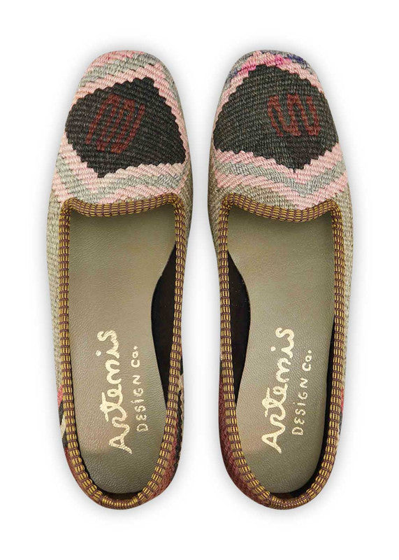 The Artemis Design & Co Women's Loafer is a stylish and versatile footwear choice characterized by a sophisticated color palette. Combining shades of blue, cream, maroon, black, and grey, these loafers offer a timeless and elegant look. Meticulously crafted for both fashion and comfort, they effortlessly complement a variety of outfits. (Front View)