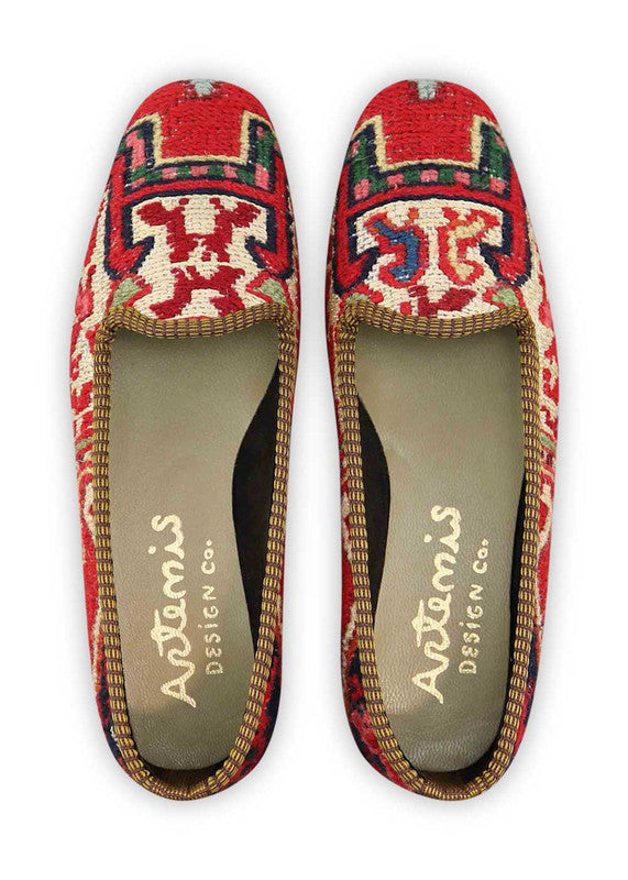 The Artemis Design & Co Women's Loafer is a stunning footwear choice that embraces a harmonious blend of colors. With a palette consisting of red, cream, white, maroon, blue, khaki, brown, and light green, these loafers offer a versatile and chic addition to your wardrobe. Meticulously crafted for both style and comfort, they seamlessly complement a wide range of outfits. (Front View)
