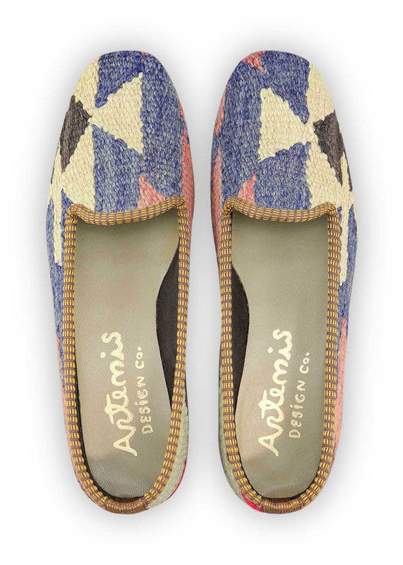 Artemis Design & Co Women's Loafers showcase a modern fusion of style and comfort, featuring a striking color combination of deep blue, dark grey, red, and crisp white. These loafers embody sophistication with a contemporary twist, seamlessly blending bold hues for a fashion-forward statement. (Front View)