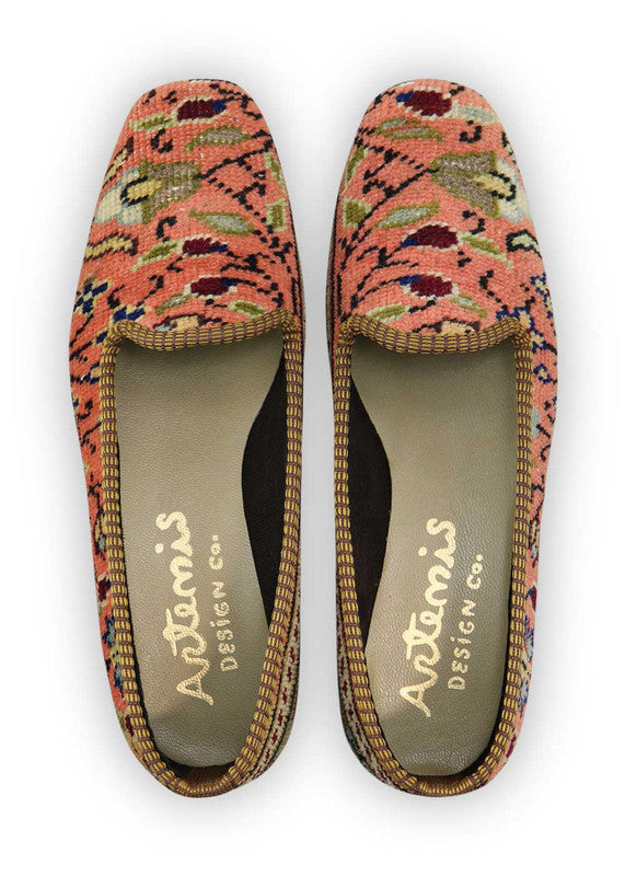Artemis Design Co. Women's Loafers captivate with a stylish and versatile color palette, featuring peach, maroon, blue, grey, teal, brown, khaki, and sky blue. Meticulously crafted, these loafers seamlessly blend warm and cool tones, creating a chic and fashionable footwear option. The dynamic interplay of colors, from the soft peach and maroon to the calming blues and greys, accented by the rich browns, khakis, and vibrant teal, adds a touch of modern flair. (Front View)