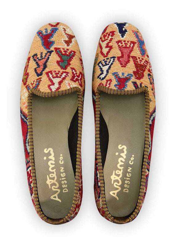 Artemis Design Co. Women's Loafers are a celebration of style with a patriotic color palette of red, white, and blue, complemented by the soft hues of peach, teal, khaki, and sky blue. Meticulously crafted, these loafers seamlessly blend bold and serene tones, creating a versatile and eye-catching footwear option. (Front View)