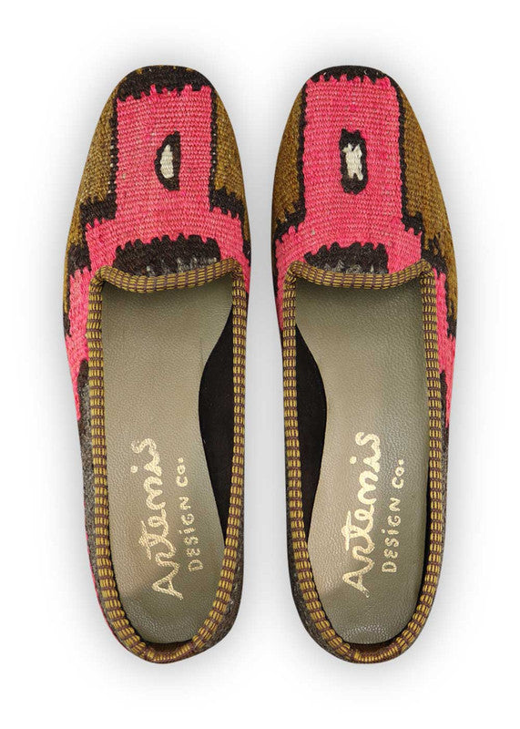 Artemis Design Co. Women's Loafers redefine chic with a sophisticated color palette of grey, black, fuchsia, and brown. Meticulously crafted, these loafers seamlessly blend classic and vibrant tones, creating a versatile and stylish footwear option. The dynamic interplay of colors, from the neutral greys and blacks to the bold fuchsia and rich brown, adds a touch of modern flair. (Front View)