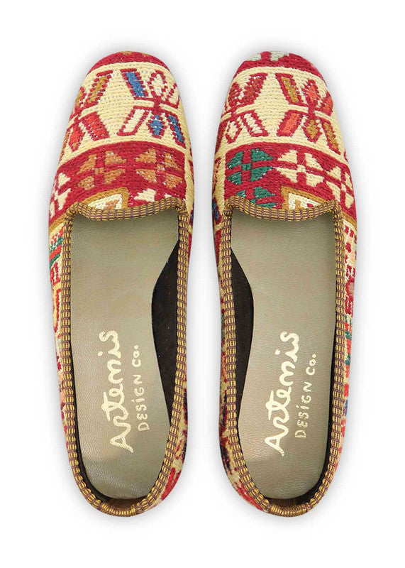 The Artemis Design & Co Women's Loafer is a stunning footwear choice that embraces a harmonious blend of colors. With a palette consisting of red, cream, white, maroon, blue, khaki, brown, and light green, these loafers offer a versatile and chic addition to your wardrobe. Meticulously crafted for both style and comfort, they seamlessly complement a wide range of outfits. (Front View)