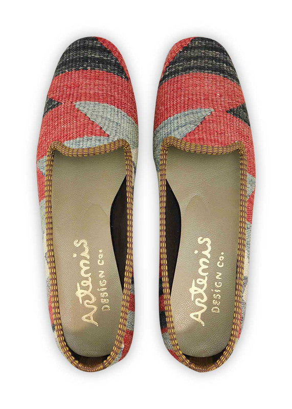 The Artemis Design & Co Women's Loafer is a fashionable and versatile footwear choice that embraces a vibrant color palette. With a combination of red, green, white, blue, black, and grey, these loafers offer a bold and stylish statement. Crafted for both aesthetics and comfort, they effortlessly complement a variety of outfits. (Front View)