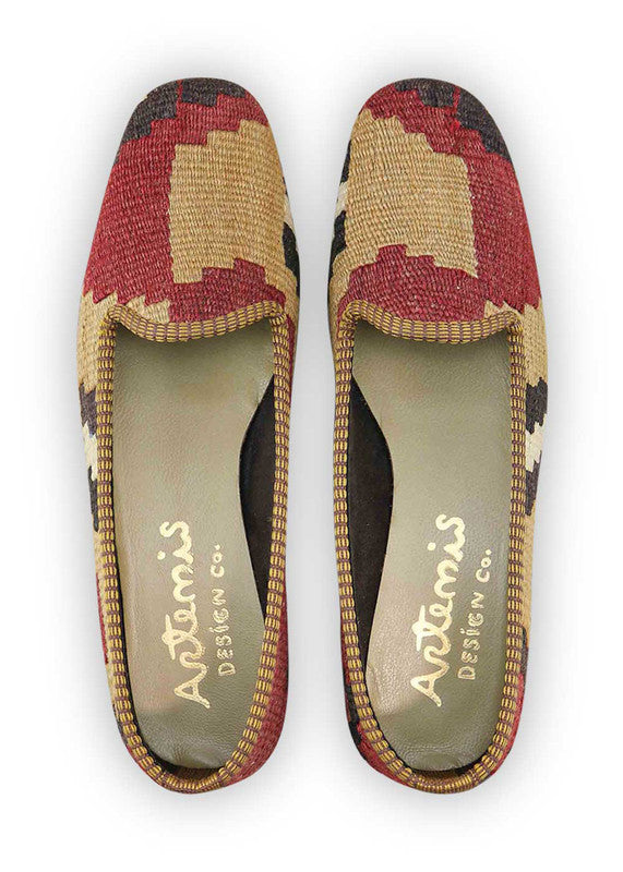 Artemis Design & Co Women's Loafers redefine elegance with a chic color palette of black, khaki, maroon, pink, and white. These sophisticated loafers exude timeless style and versatility, making them an essential addition to any wardrobe. The combination of rich, muted tones and a touch of pink adds a subtle pop of femininity. (Front View)