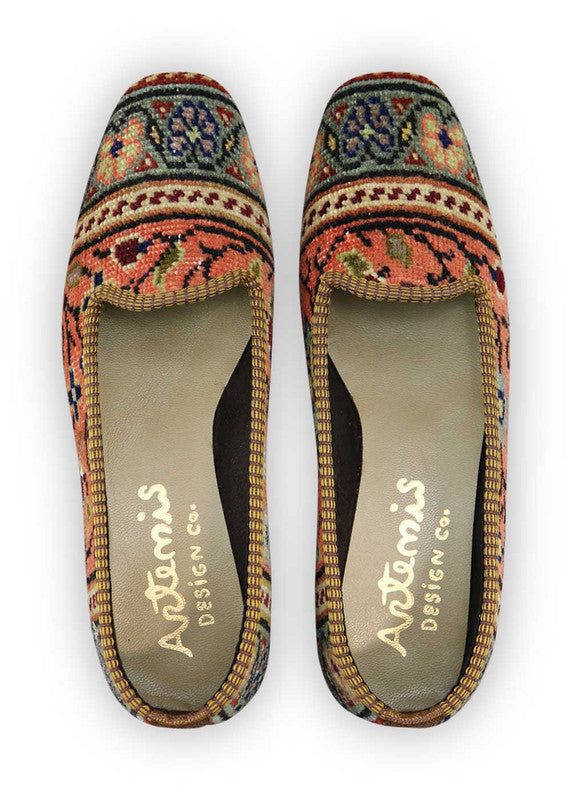 Artemis Design Co. Women's Loafers captivate with a stylish and versatile color palette, featuring peach, maroon, blue, grey, teal, brown, khaki, and sky blue. Meticulously crafted, these loafers seamlessly blend warm and cool tones, creating a chic and fashionable footwear option. The dynamic interplay of colors, from the soft peach and maroon to the calming blues and greys, accented by the rich browns, khakis, and vibrant teal, adds a touch of modern flair. (Front View)