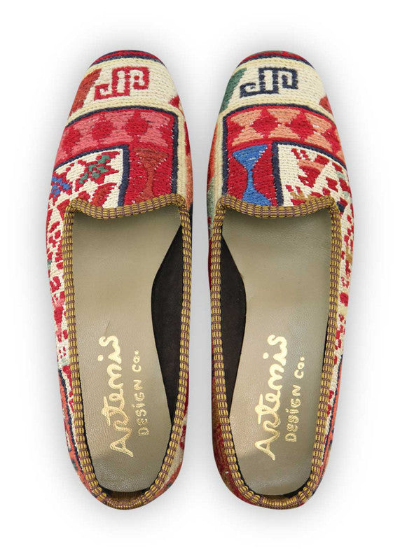 Artemis Design Co. Women's Loafers exude vibrant charm with a captivating color palette of red, blue, white, peach, mint green, and brown. Meticulously crafted, these loafers seamlessly blend bold and soft tones, creating a versatile and stylish footwear option. The dynamic interplay of colors, from the classic red, blue, and white to the soft peach, mint green, and rich brown, adds a touch of modern flair. (Front View)