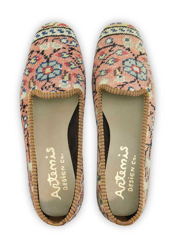 The Artemis Design & Co Women's Loafer is a fashion-forward footwear choice with a delightful color scheme. Featuring a combination of peach, brown, white, blue, red, and cream, these loafers exude style and versatility. Carefully designed for both aesthetics and comfort, they effortlessly complement various outfits. (Front View)