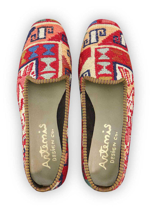Artemis Design & Co Women's Loafers showcase a harmonious blend of vibrant colors, including striking red and deep blue, complemented by crisp white and creamy tones. Subtle hints of peach and refreshing green add a touch of femininity and nature-inspired flair. (Front View)