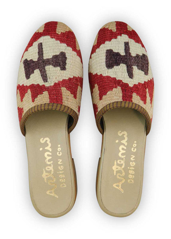 The Artemis Women's Slides offer a charming color combination of red, beige, white, and brown. These slides feature a delicate blend of warm and neutral tones, creating a balanced and versatile look. Whether you're lounging at home or stepping out for a casual occasion, these slides are the perfect choice. (Front View)