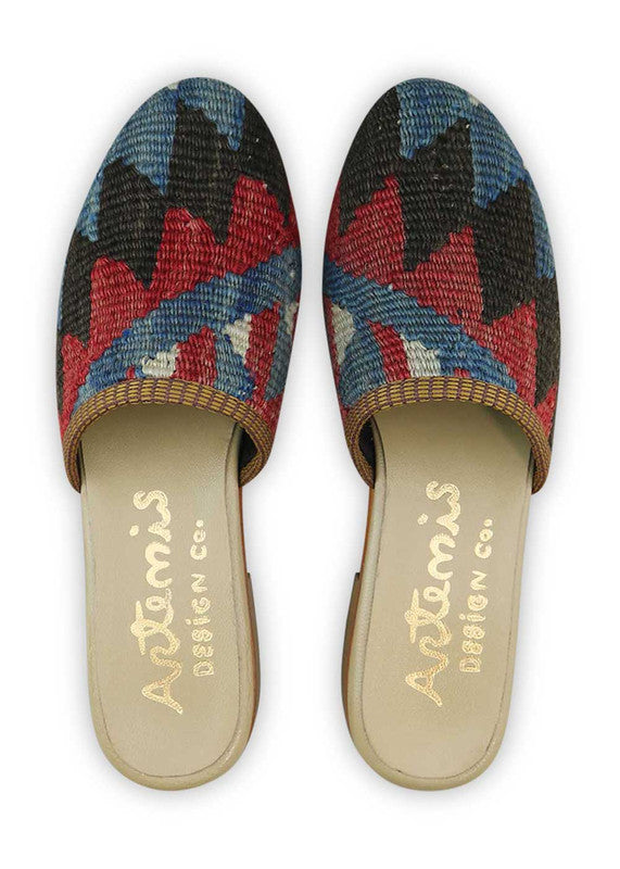 The Artemis Women's Slides offer a dynamic color combination of black, red, blue, and white. These slides feature a vibrant interplay of bold and classic tones, creating a modern and versatile look. Whether you're relaxing at home or heading out for a casual occasion, these slides are the perfect choice.(Front View)