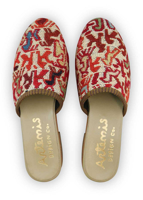 The Artemis Women's Slides feature a chic color combination of white, red, brown, grey, and light orange. These slides offer a balanced mix of bold and neutral tones, creating a stylish and versatile look. (Front View)