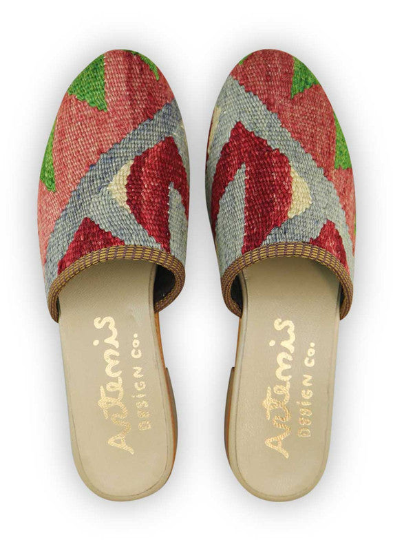 The Artemis Women's Slides feature a dynamic color combination of green, red, blue, and white. These slides offer a vibrant blend of bold and refreshing tones, creating an energetic and stylish look. Whether you're strolling by the beach or exploring the city streets, these slides are the perfect choice. (Front View)