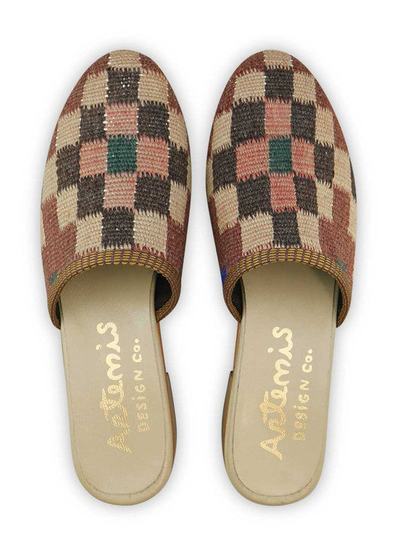 The Artemis Women's Slides feature an elegant color combination of maroon, brown, rose gold, black, and pink. These slides offer a sophisticated blend of warm and metallic tones, creating a stylish and refined look. Whether you're relaxing at home or stepping out for a casual occasion, these slides are the perfect choice. (Front View)